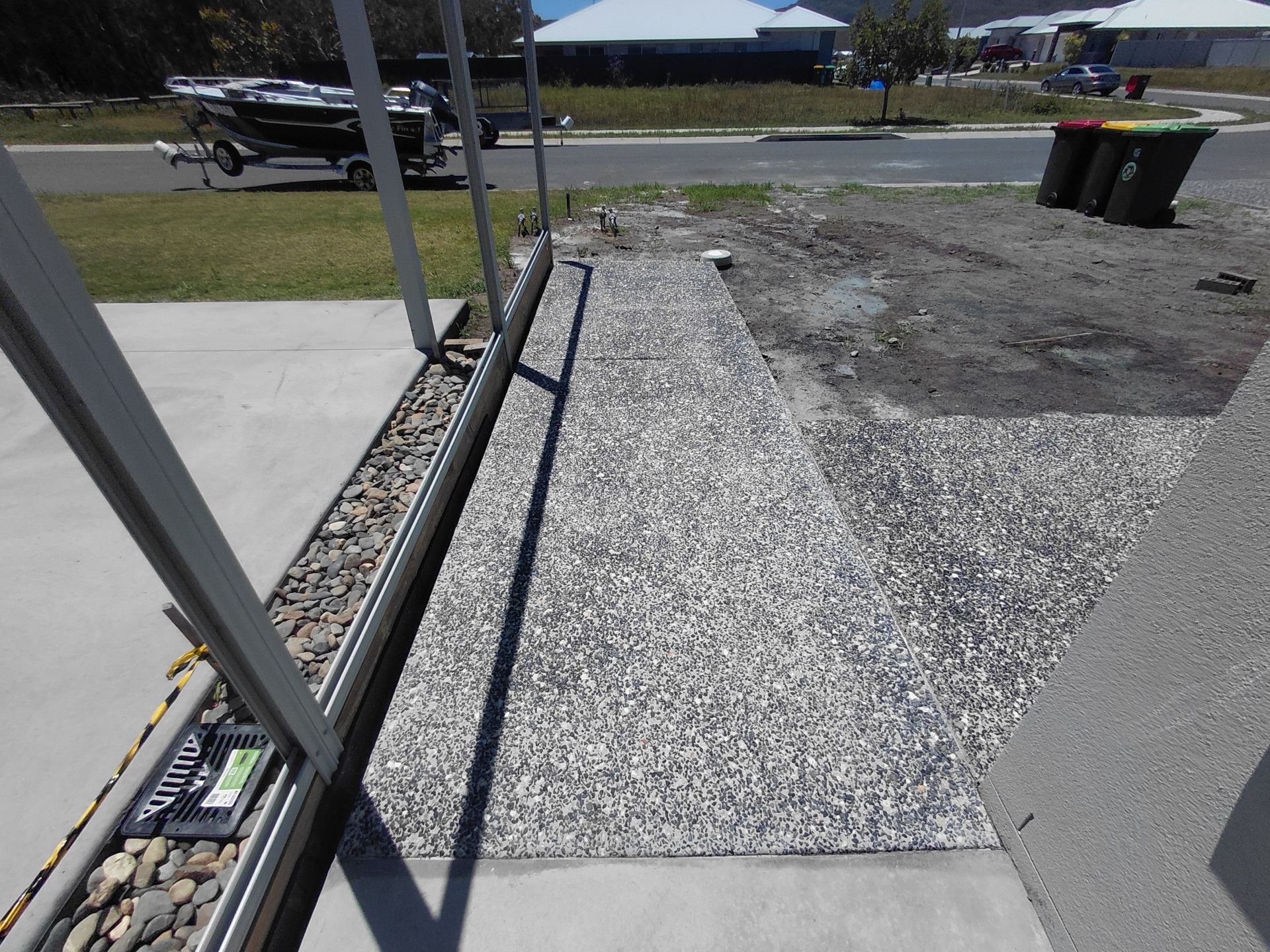 Gravel Walkway Beside a Concrete Path and Building — Kempsey Concrete Contractors PTY LTD In Dondingalong, NSW