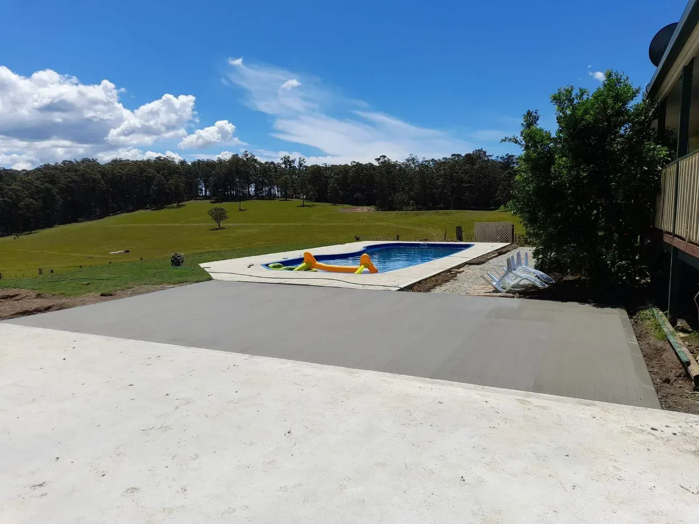 Sunny Backyard with An Empty Covered Pool — Kempsey Concrete Contractors PTY LTD In Dondingalong, NSW