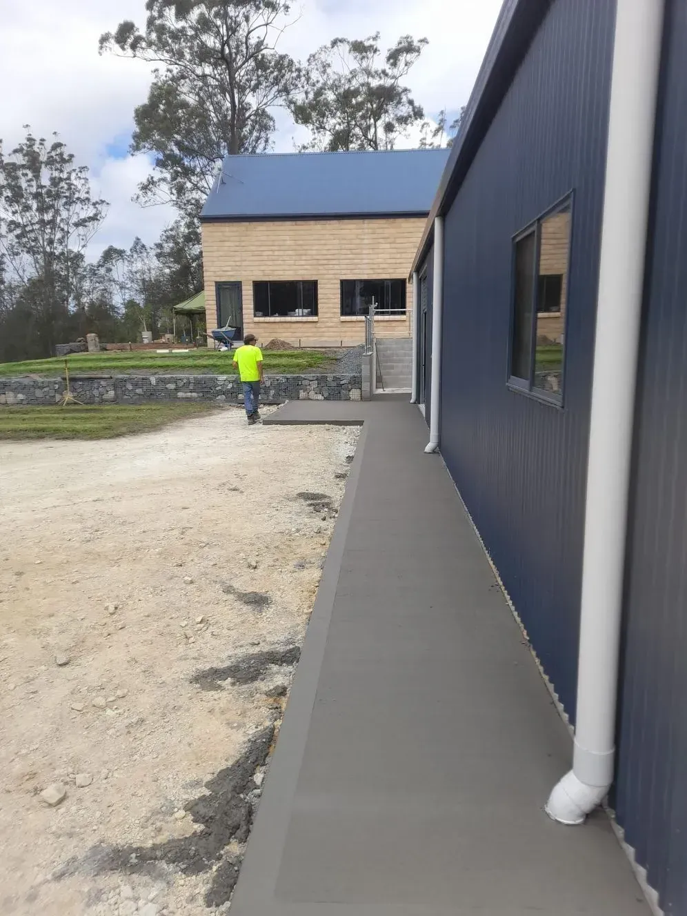 Construction Site with A Worker in A Bright Jacket — Kempsey Concrete Contractors PTY LTD In Dondingalong, NSW