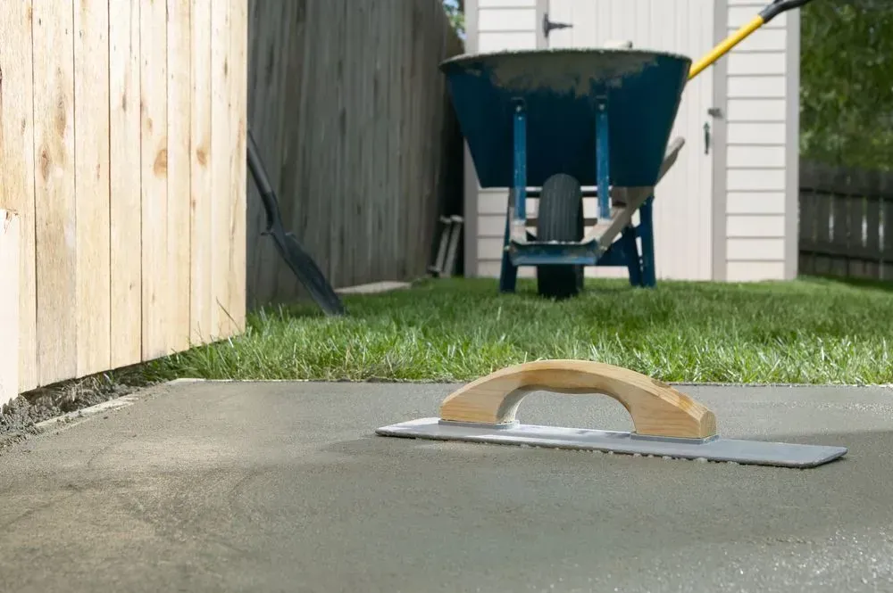 Wheelbarrow in A Driveway with A Small Tool — Kempsey Concrete Contractors PTY LTD In South West Rocks, NSW