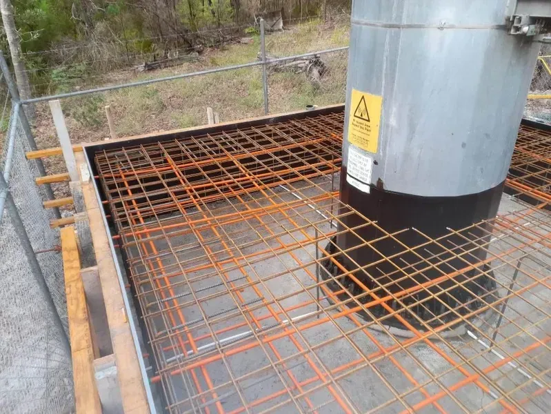 Rusty Steel Grating Platform Around a Gray Industrial Tank — Kempsey Concrete Contractors PTY LTD In Nambucca Heads, NSW