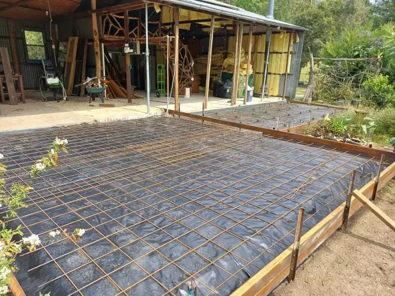 Rebar Grid and Black Sheeting for A Foundation Slab at A Rural Construction Site — Kempsey Concrete Contractors PTY LTD In Port Macquarie, NSW