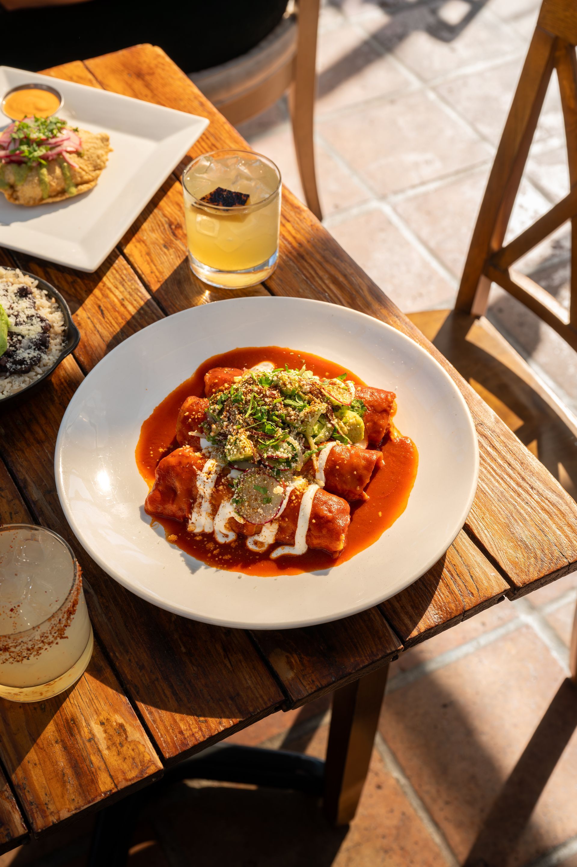 A plate of food is sitting on a wooden table.