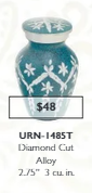 small blue keepsake urn with a white flower pattern