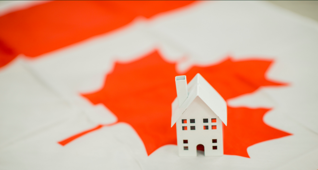 Canadian flag with a white house prop on it