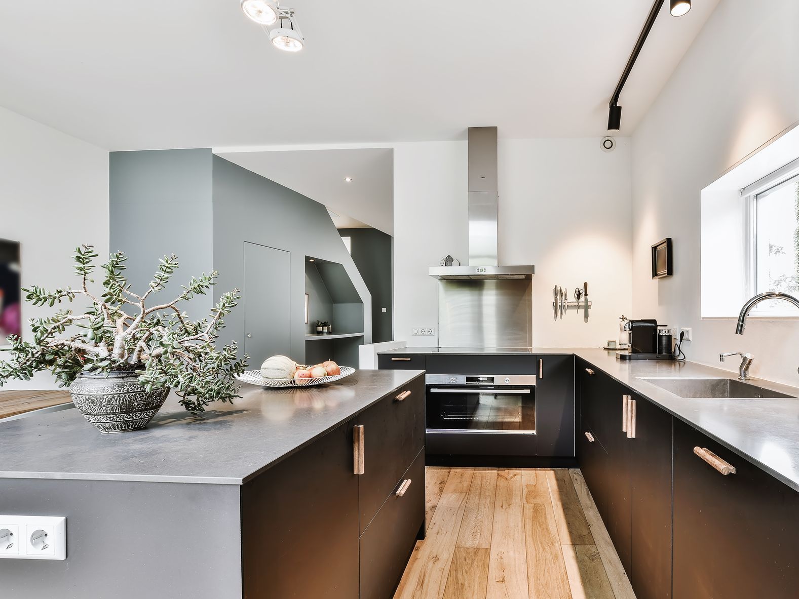 Modern Kitchen with black cabinets and grey countertop