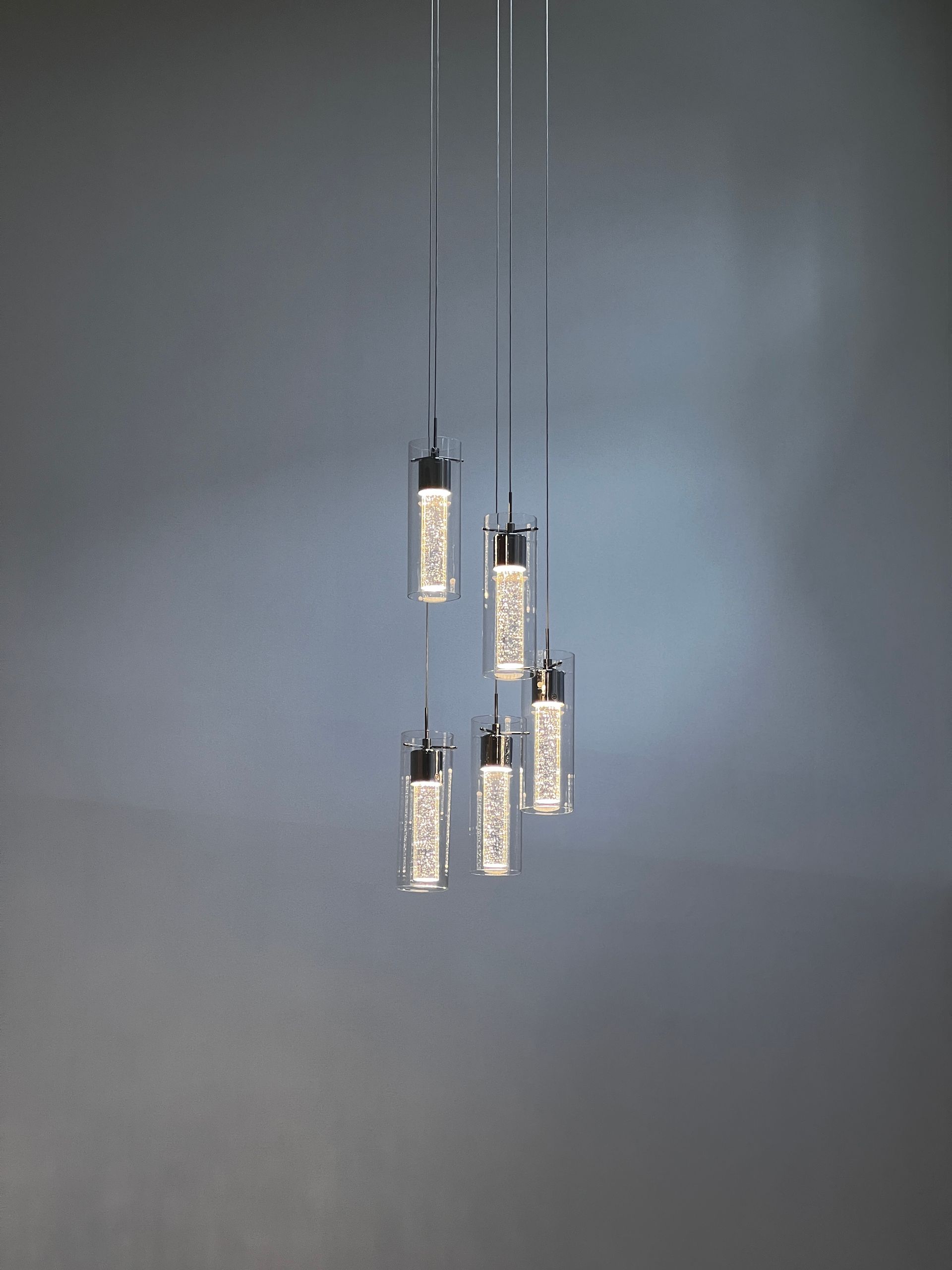 Electrical fixture with Pendant lighting and sparkling glass.