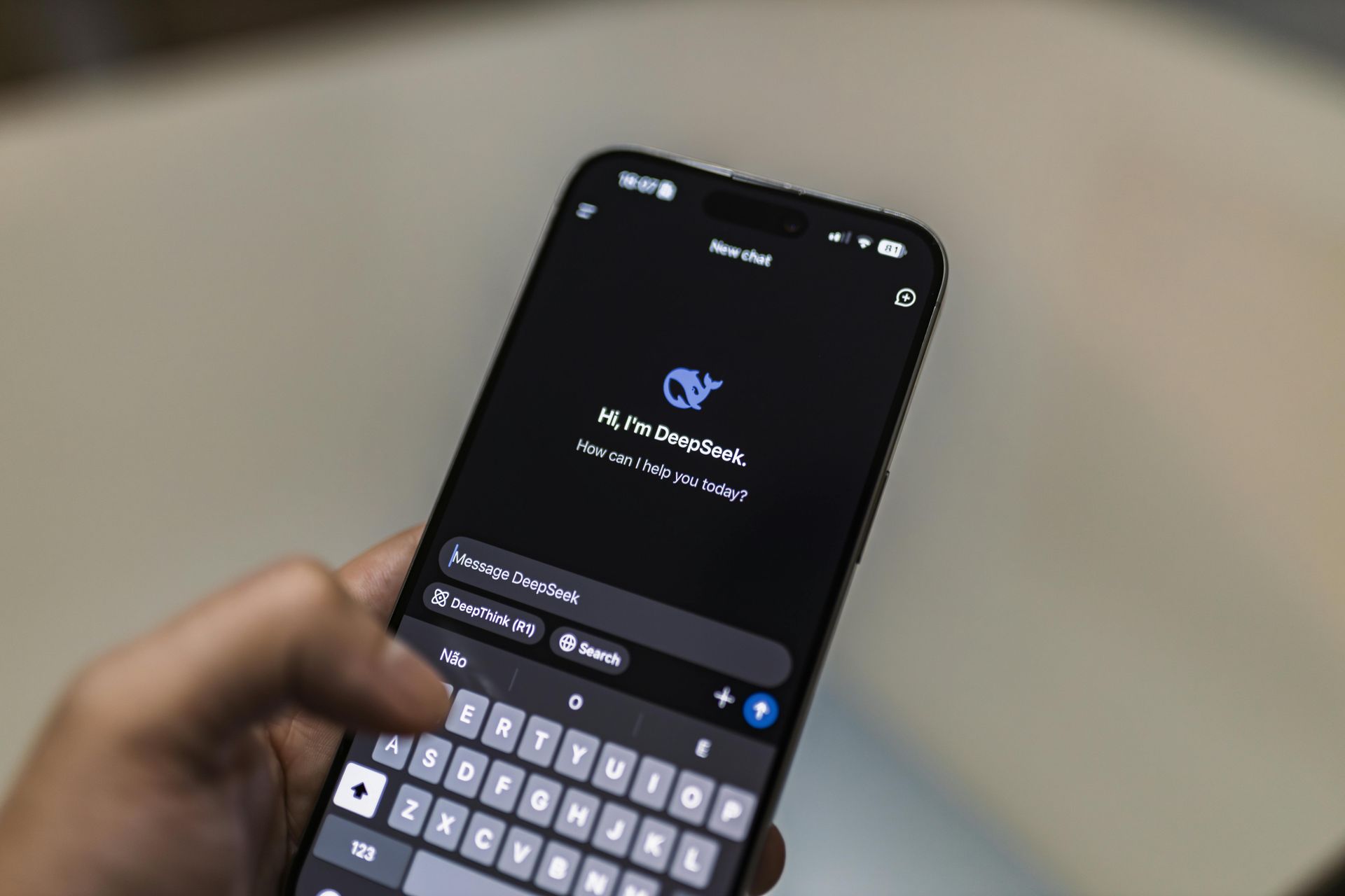 A person is holding a cell phone chatting with a chatbot A person is holding a cell phone chatting with a chatbot