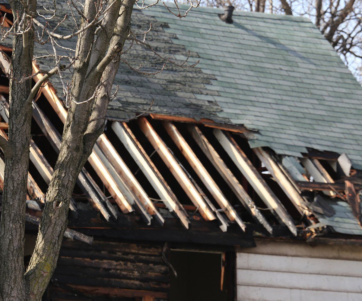 Damaged Residential Roof By Fire — Jacksonville, FL — Triton Roofing and Restoration Damaged Residential Roof By Fire — Jacksonville, FL — Triton Roofing and Restoration