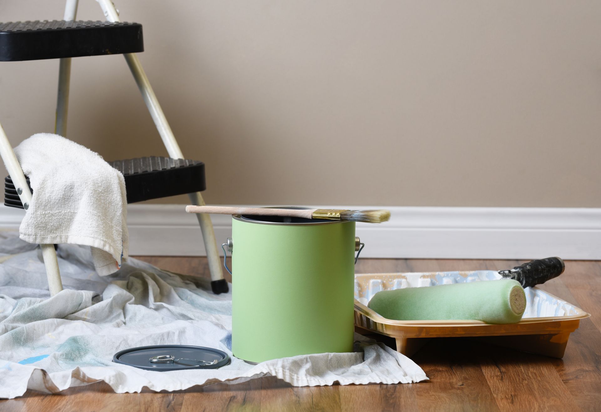Equipment for painting an interior room.

