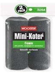 Two-pack of Wooster Mini-Koter foam paint rollers. Black rollers in clear packaging, green accents.
