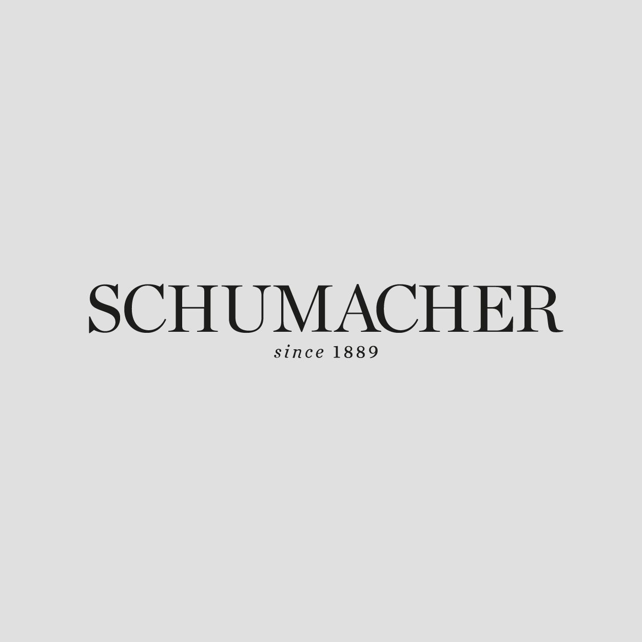 Schumacher logo with text "SCHUMACHER" and "since 1889" on a gray background.