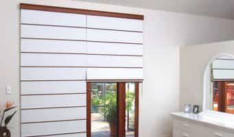 A Room With A Dresser And A Window With Blinds On It — Summerland Screens & Awnings In Suffolk Park, NSW