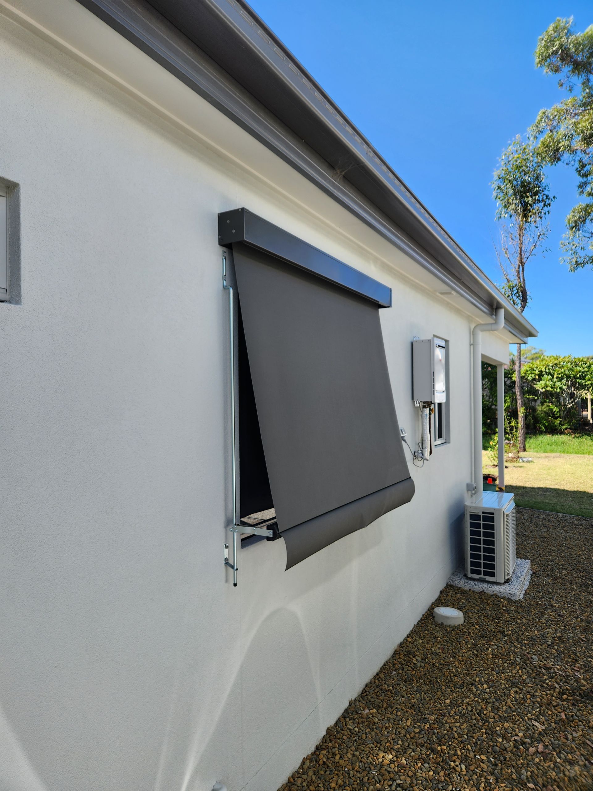 Automatic awning on the side of a house— Summerland Screens & Awnings In Ballina, NSW