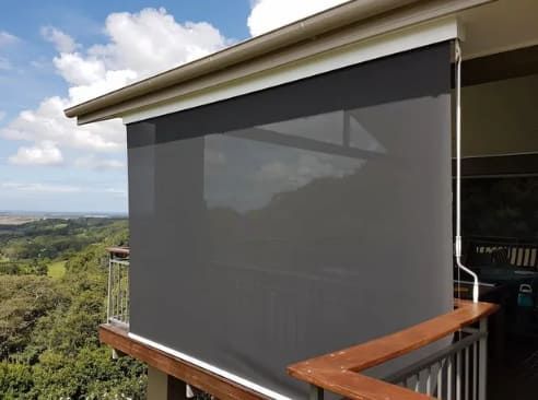 A Balcony With A Gray Blind On The Side Of It — Summerland Screens & Awnings In Ballina, NSW