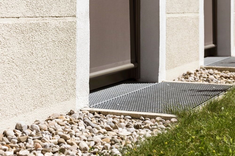 A Close Up Of A Metal Grate On The Side Of A Building — Summerland Screens & Awnings In Lennox Head, NSW