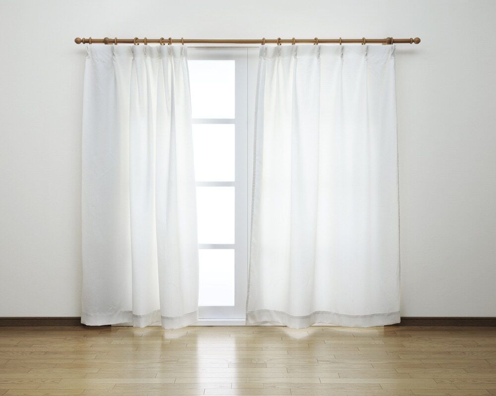 An Empty Room With A Window And White Curtains — Summerland Screens & Awnings In Lennox Head, NSW