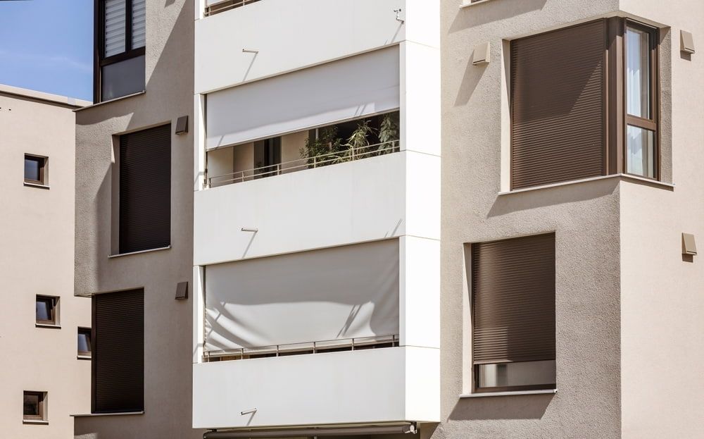 A Building With A Lot Of Windows And Balconies — Summerland Screens & Awnings In Alstonville, NSW