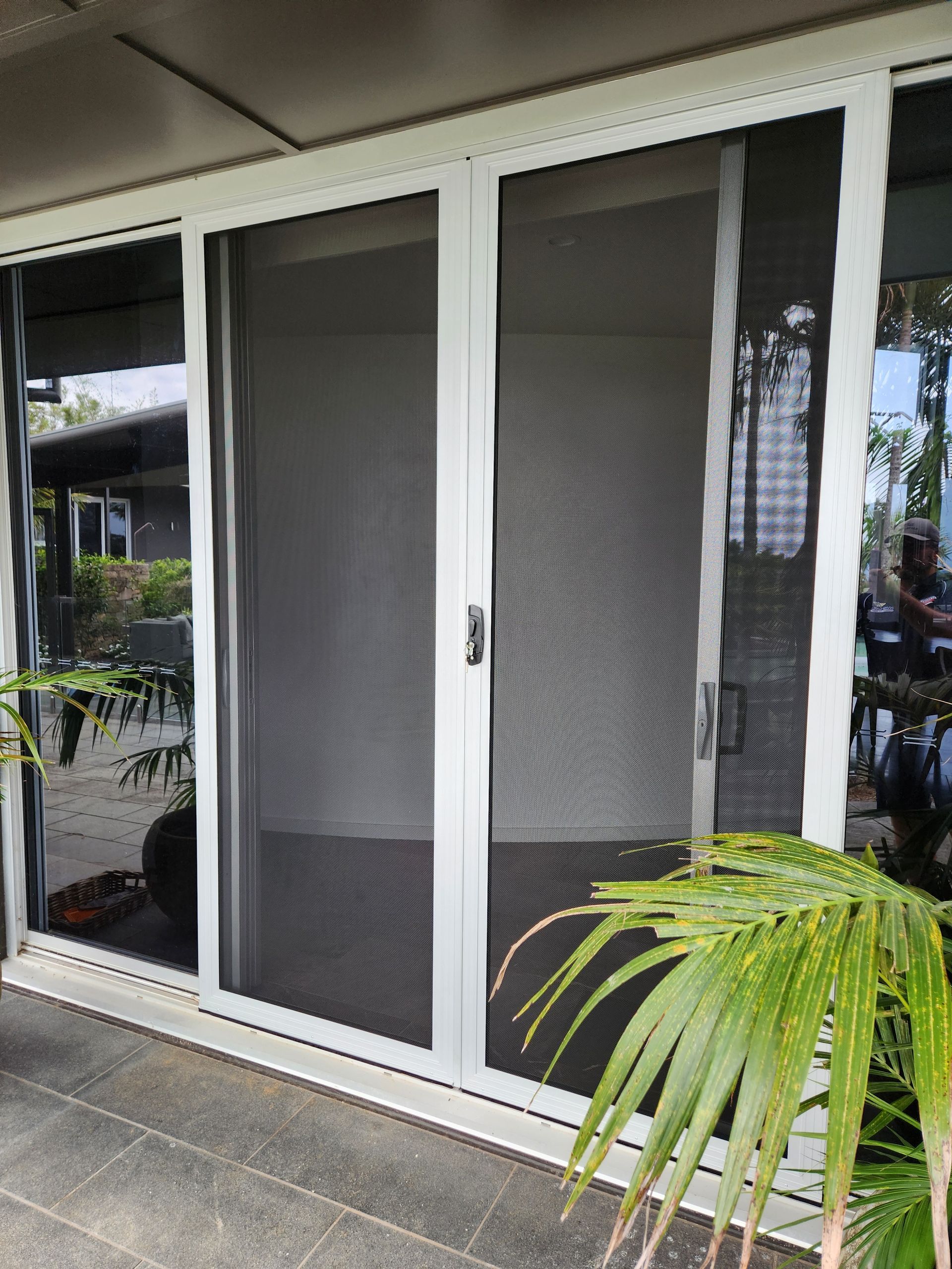 Security Screen Sliding doors at the front of a home
— Summerland Screens & Awnings In Ballina, NSW