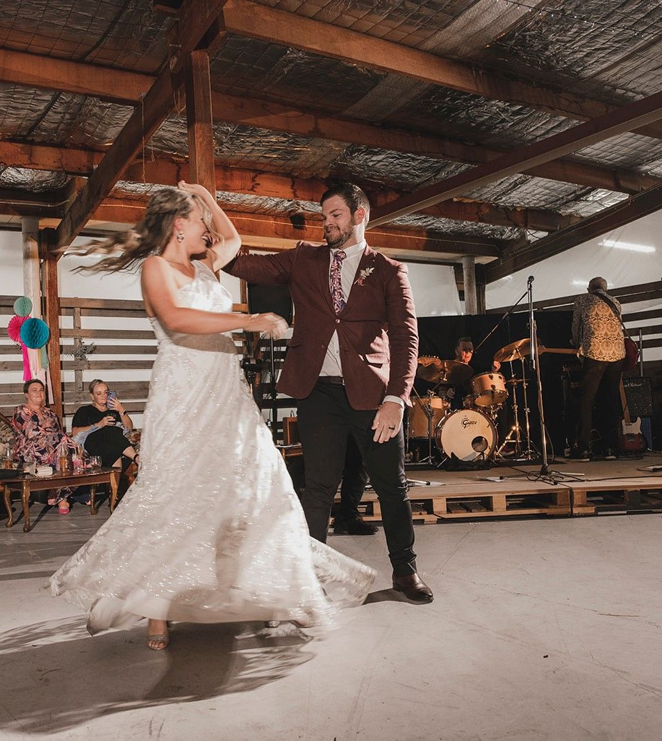 Bride and Groom Dance at Reception in a Rustic Barn — Rustique on the Coast In Ourimbah, NSW