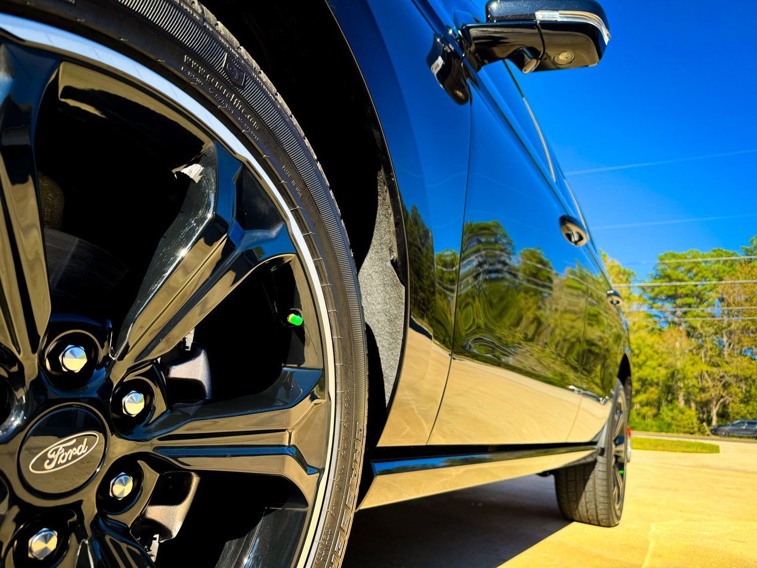 A ford car is parked on the side of the road