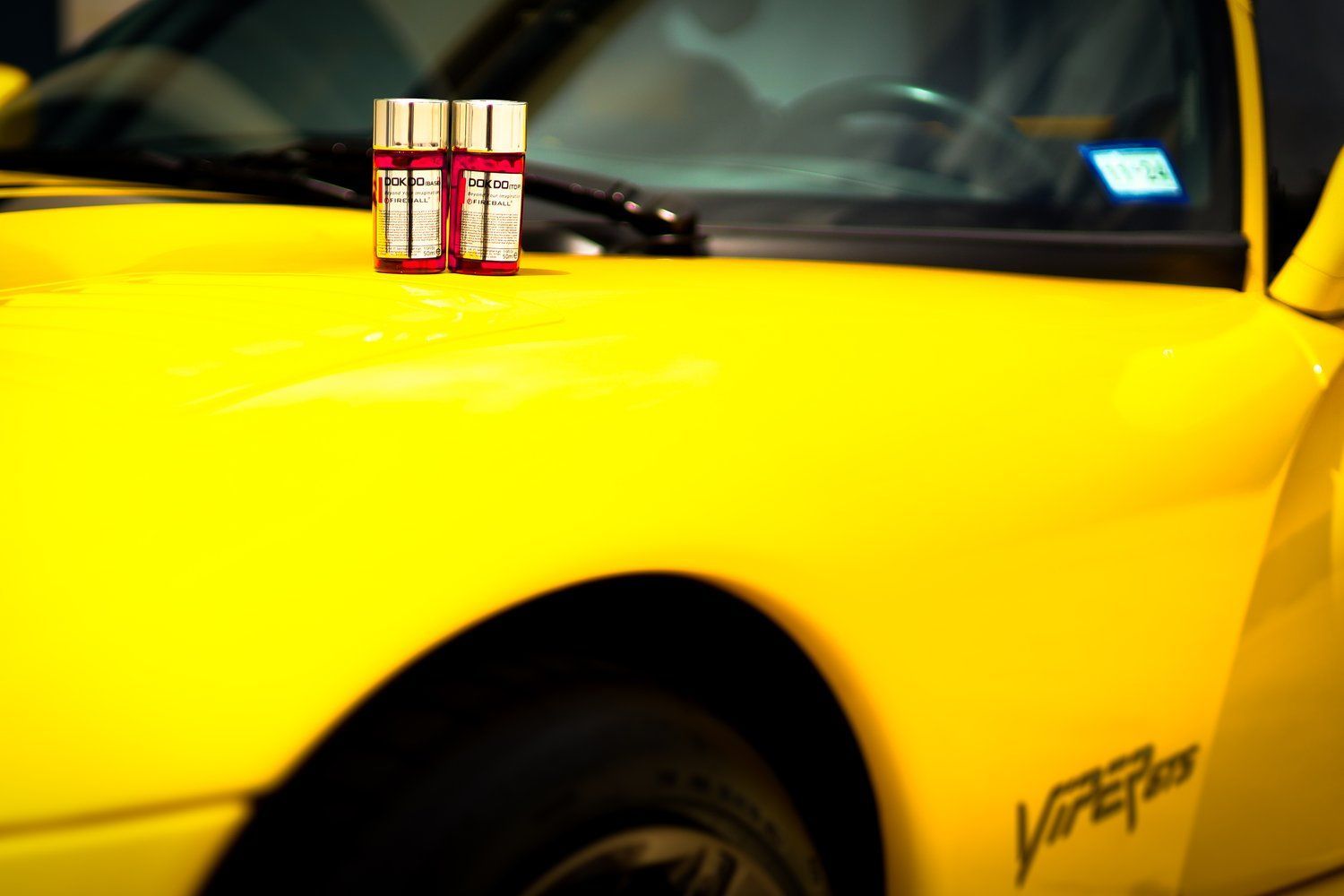 A yellow car with the word viper on the side
