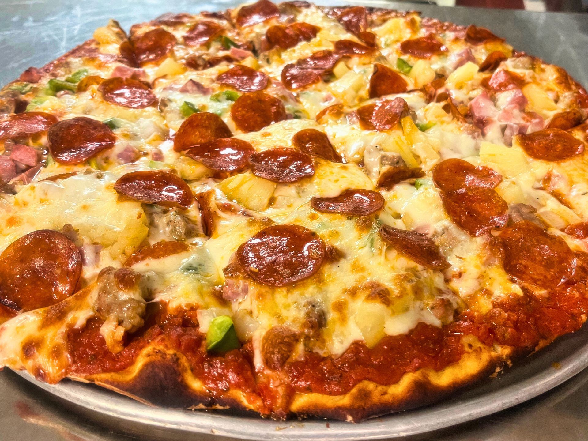 Supreme pizza with pineapple at Dockers North