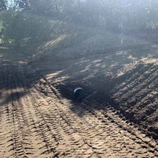 Tractor Digging a Hole in Large Field - Elizabeth, CO – NRK Skidsteer