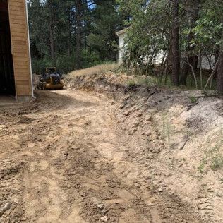 Bulldozer Next to House - Elizabeth, CO – NRK Skidsteer