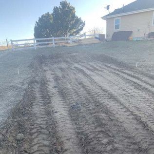 Road with White Fence and House - Elizabeth, CO – NRK Skidsteer