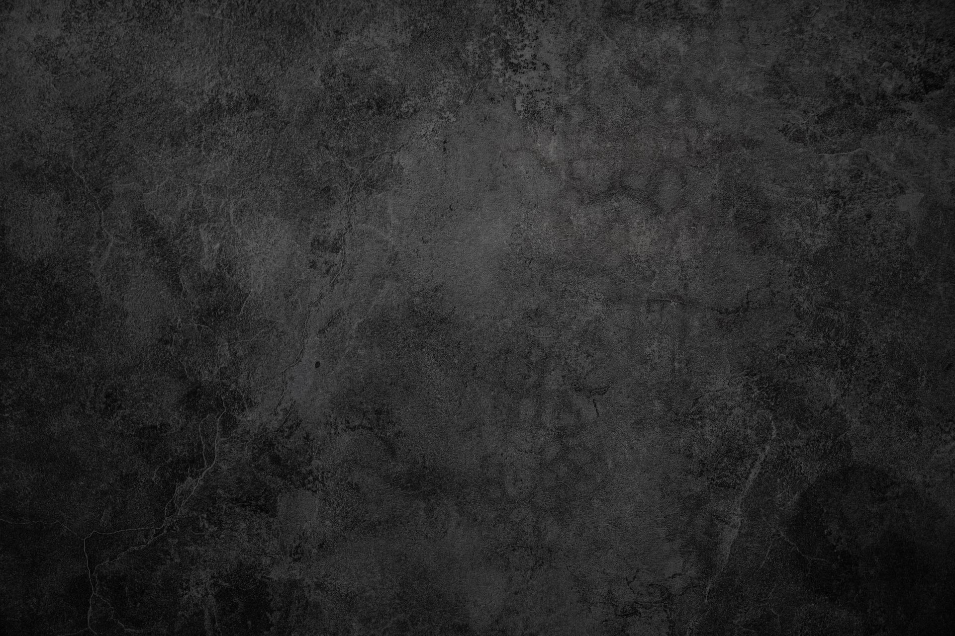Dark gray concrete wall with rough texture. Dark gray concrete wall with rough texture.