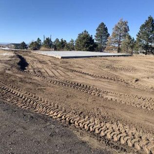 Dirt Road Going Through Field with Trees - Elizabeth, CO – NRK Skidsteer