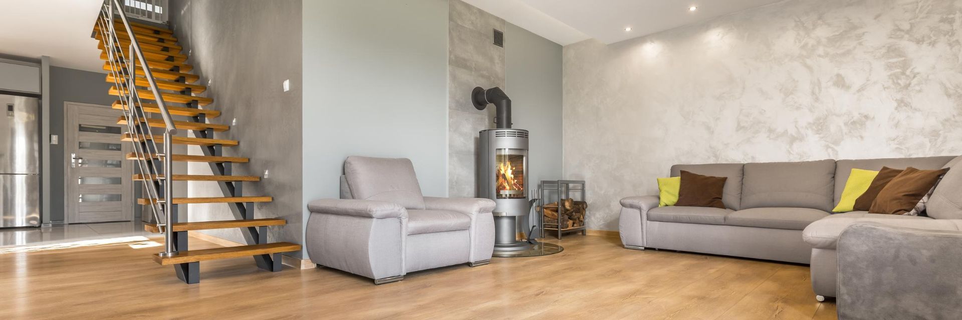 A Living Room With A Couch , Chair , Fireplace And Stairs — Donnelly Painting In Wollongbar, NSW