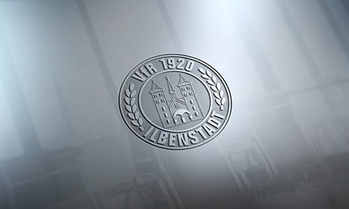 Ein silbernes Logo mit einem Schloss in der Mitte auf grauem Hintergrund.