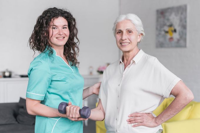 physiotherapist and patient smiling