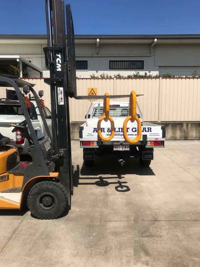 A Yellow Tcm Forklift Sits in a Paved Lot — Air & Lift Gear in Buderim, QLD