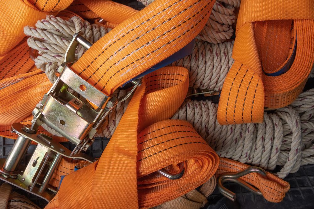 Orange Ratchet Straps and Rope With Metal Buckle Close-up — Air & Lift Gear in Buderim, QLD