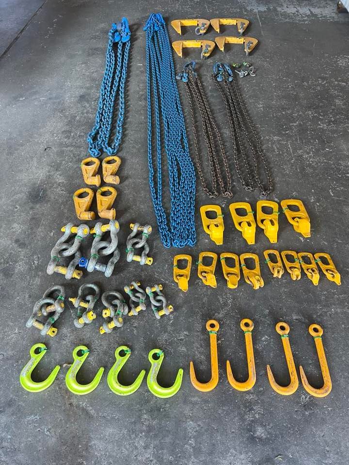 Assorted Heavy Duty Lifting Slings, Straps, and Hooks Arranged on a Concrete Floor — Air & Lift Gear in Buderim, QLD
