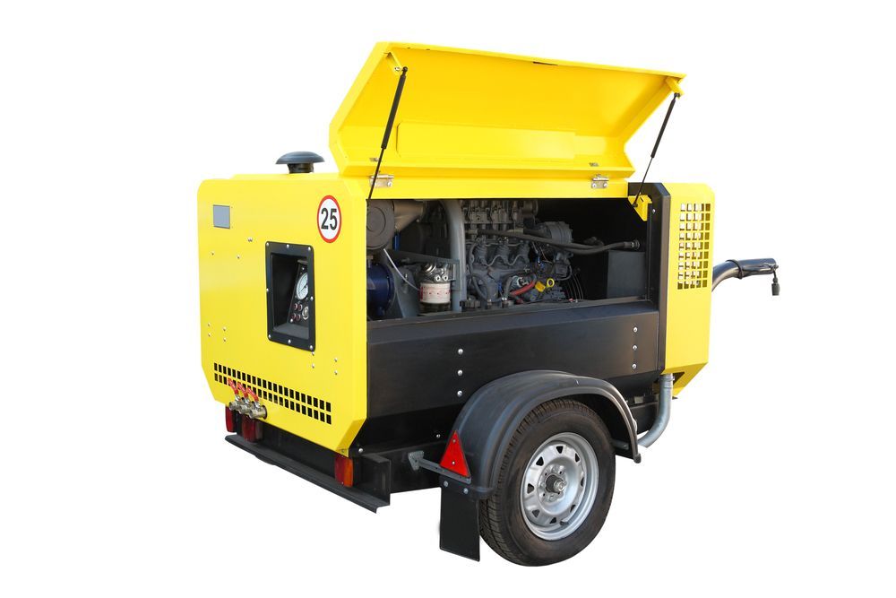 A Yellow Portable Air Compressor on Wheels With Its Side Panel Open — Air & Lift Gear in Buderim, QLD
