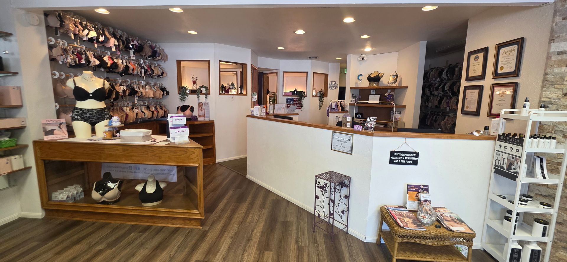 Bright shoe store interior with wall displays, white counter, and wooden display table