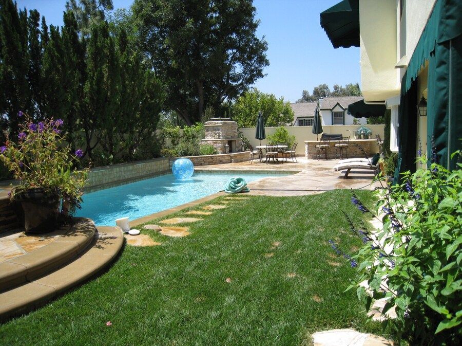 A garden filled with lots of mulch and plants.