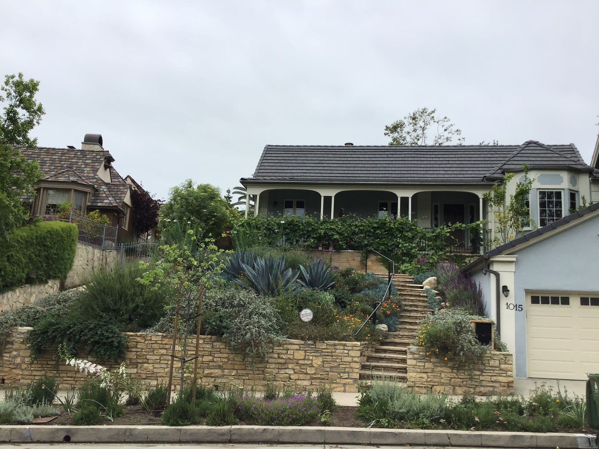 A house on a hill with stairs leading up to it