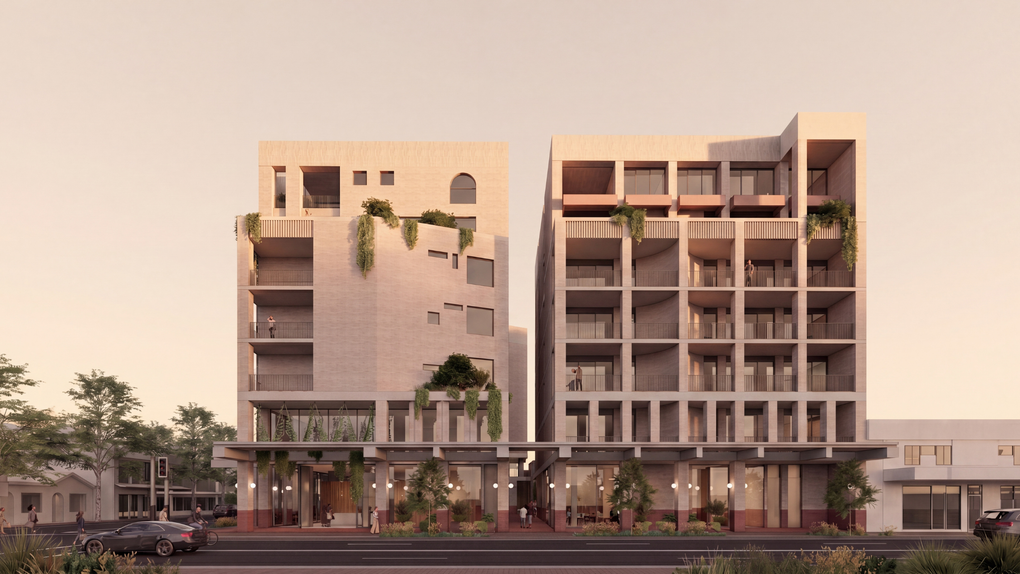 Modern mid-rise apartment building with balconies and greenery at street level at sunset