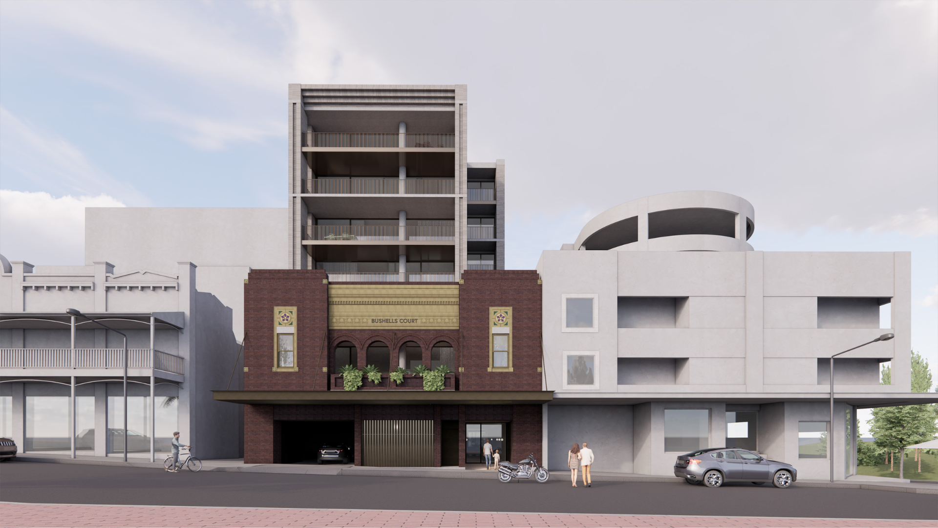 Modern multi-story buildings along a street, including a brown and white facade with cars parked nearby.