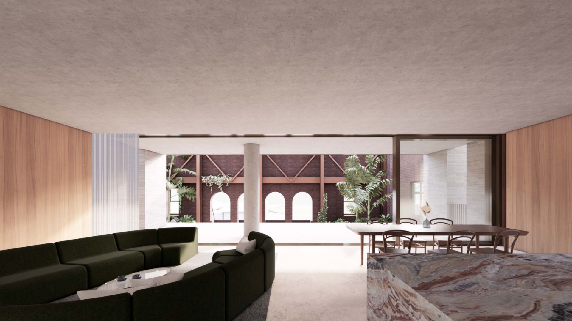 Modern living room with curved green sofa, dining table, and large sliding glass doors to a courtyard