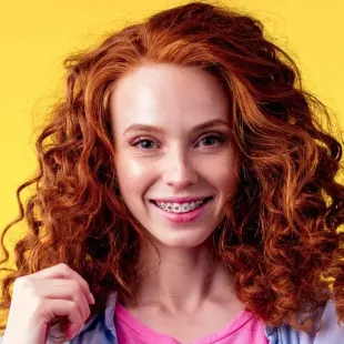 Girl with red hair and braces