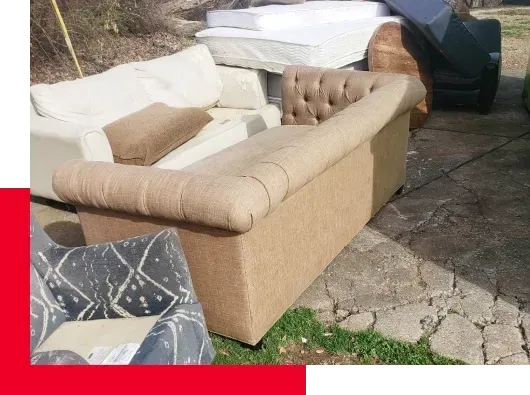 sofas and mattresses in yard, furniture removal