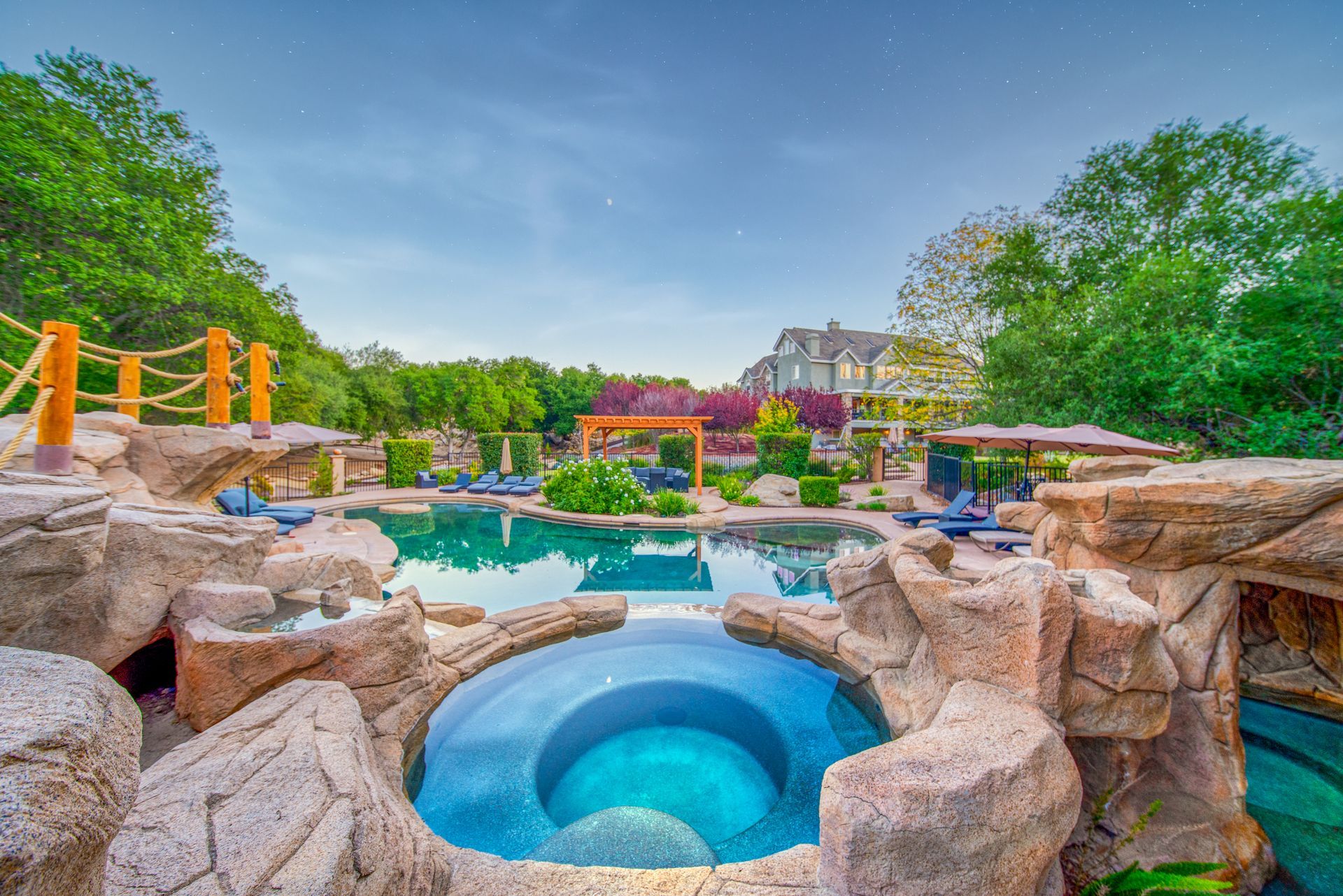 There is a fire pit in the middle of the pool.