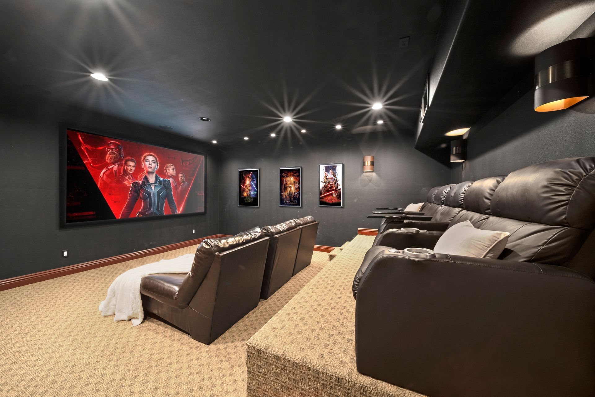 A game room with a foosball table and a basketball hoop.