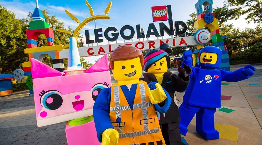 LEGOLAND California entrance with colorful LEGO characters posing in front of the sign